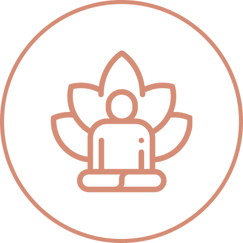Person meditating in front of lotus flower.